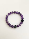 Amethyst and black natural stone bracelet with soft purple tones