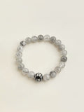 Black rutilated quartz crystal bracelet with transparent stones and dark inclusions