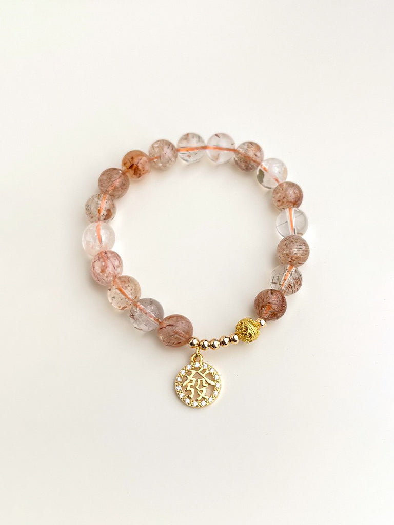 Red rutilated quartz bracelet with gold tag detail