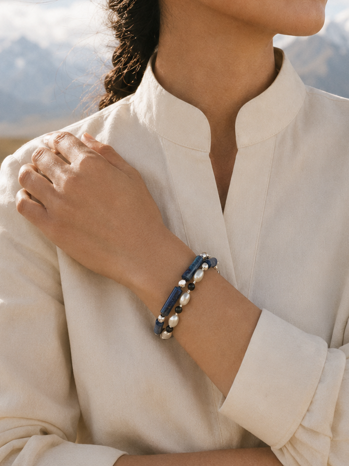 Lapis black tourmaline pearl wrap bracelet lifestyle image for layered styling