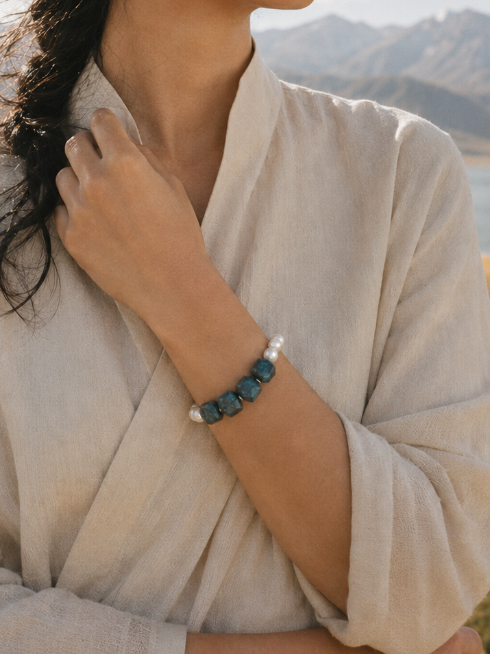 Blue apatite pearl bracelet styled in soft natural light