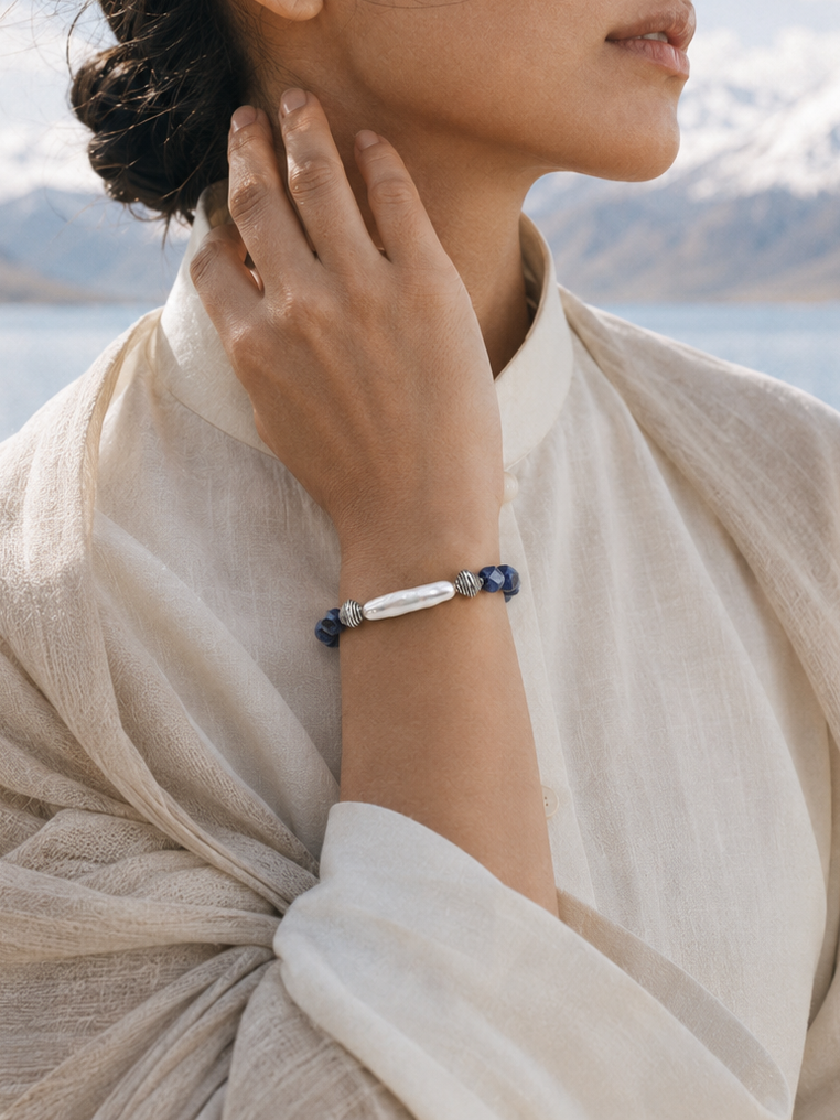 Lifestyle image of blue lace agate pearl bracelet with soft outdoor light
