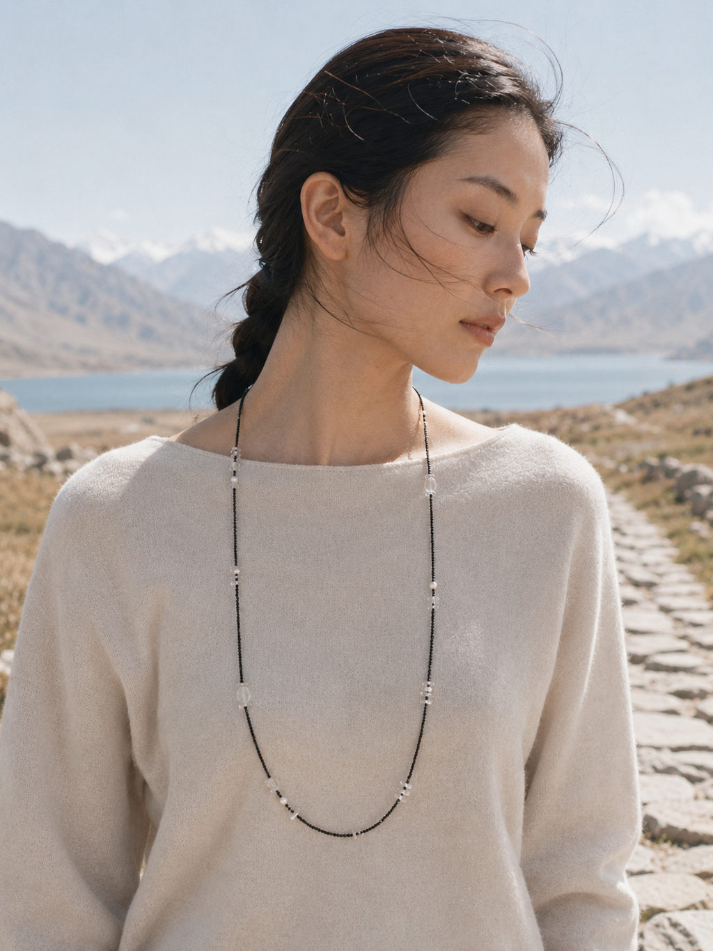 Clear quartz black tourmaline necklace lifestyle image for quiet styling